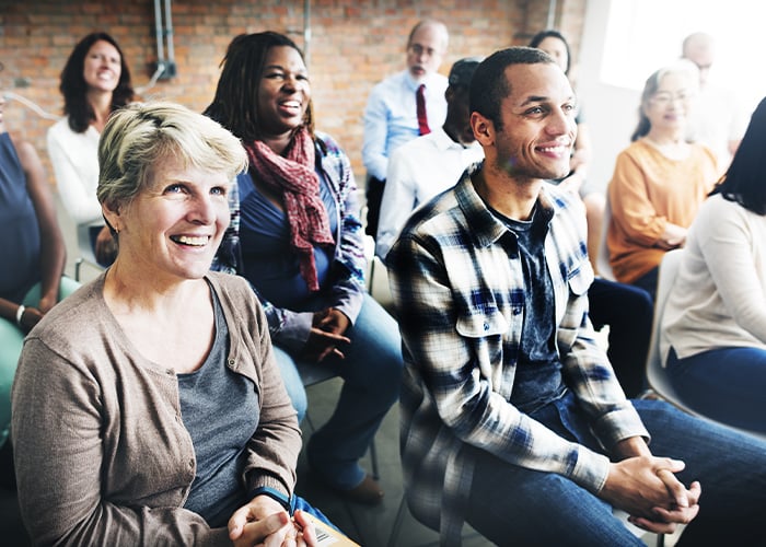 group-of-people-smiling-at-training