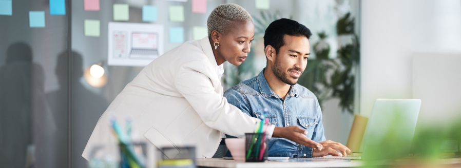 Woman and man working on a laptop together