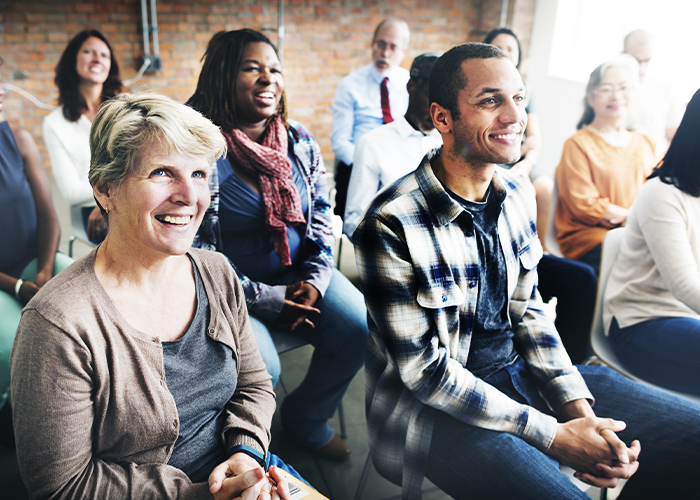 group-of-people-smiling-at-training