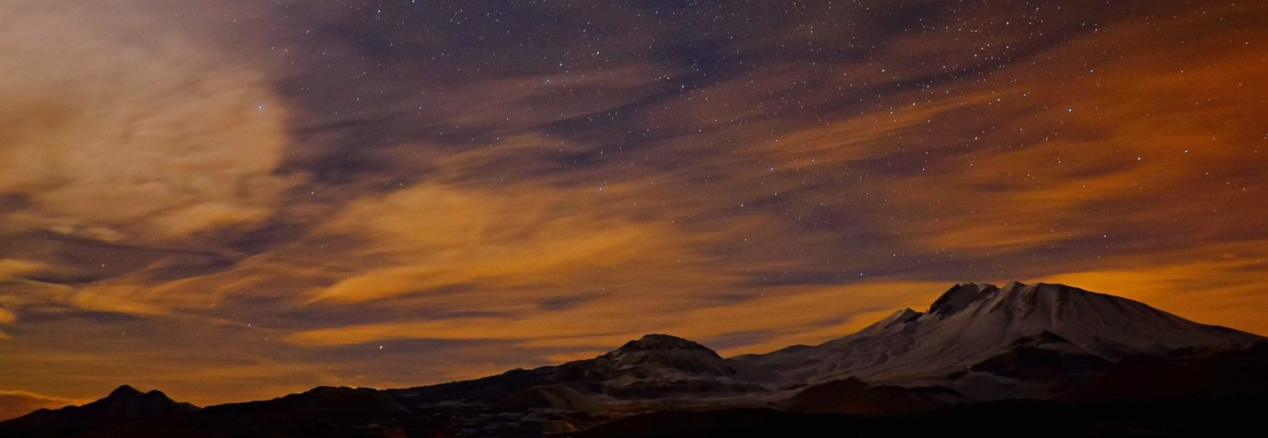 An image of mountains and a night sky