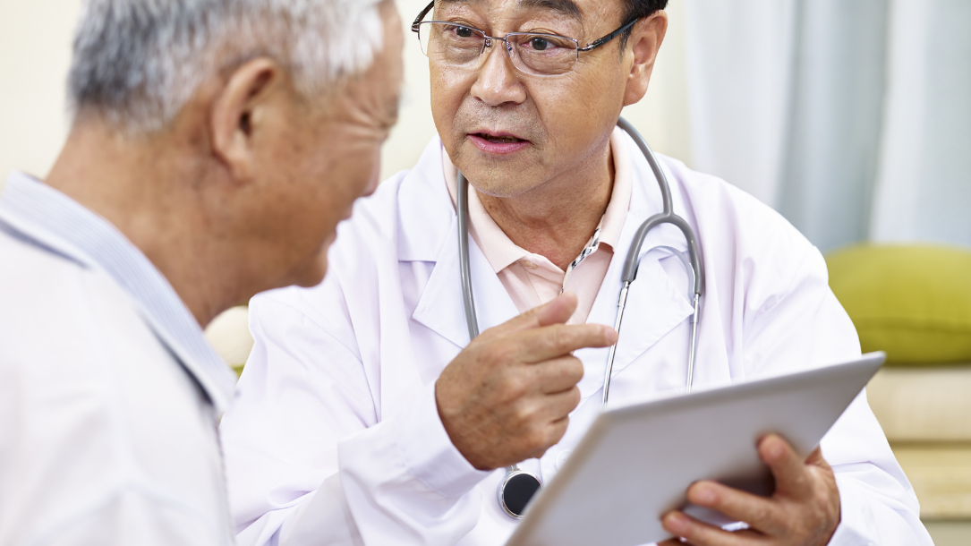 A doctor interacting with a patient who needs interpretation vs translation