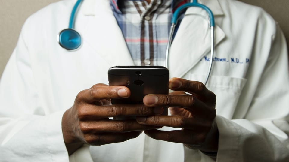 doctor-holding-phone